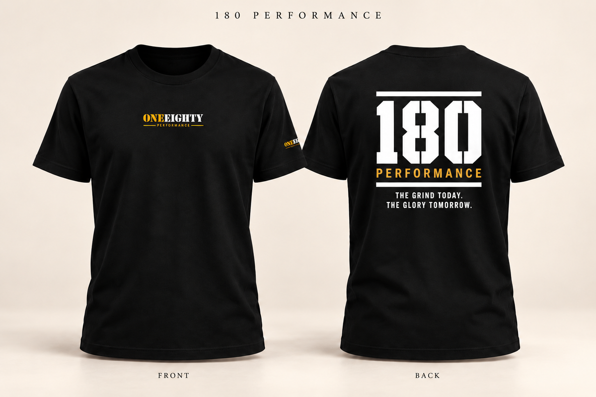 Black short-sleeve t-shirt shown from the front and back on a light beige background. The front has a small yellow and white 'ONE EIGHTY' logo on the left chest, and the back features a large white '180' with 'PERFORMANCE' and a slogan below in yellow and white.